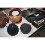 A leather hat box and top hat by Tress & Co. Londo