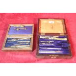 Various old drawing instruments in fitted cases
