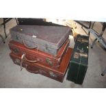 Four various vintage leather suitcases