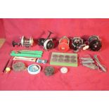 Two boxes of various fishing reels, lures, nets an