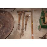 Three bundles of varying sized wood augers
