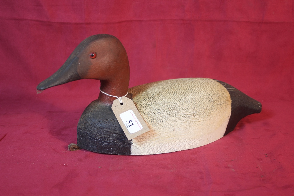 A carved decoy duck modelled by Tom Martingdale, 3