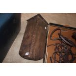 A vintage wooden saddle rack