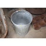 A heavy metal bin with inscription to interior "Re