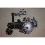 A cut out tin traction engine model 63cm long