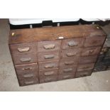 A mahogany fronted nest of twenty drawers