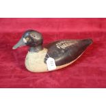 A carved wooden decoy duck, 33.5cm long