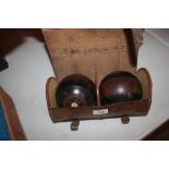 A set of two Lignum Vitae bowls in brown leather c
