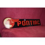 A plastic "Pontiac" advertising sign in the Art De