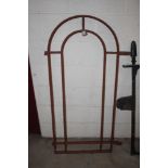 A cast iron arched window 137cm x 73cm in extremes