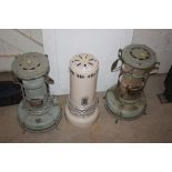 Two vintage Aladdin paraffin heaters and another s