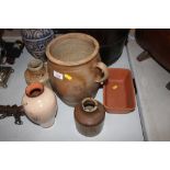 Four pottery vases and a pottery dish