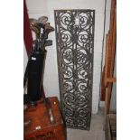 A pair of antique pierced iron grills having folia