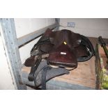 A leather saddle and pad etc.