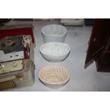 Three white glazed china jelly moulds