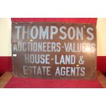 An enamel advertising sign for Thompson's Auctioneer