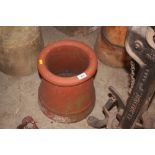 A small clay chimney pot