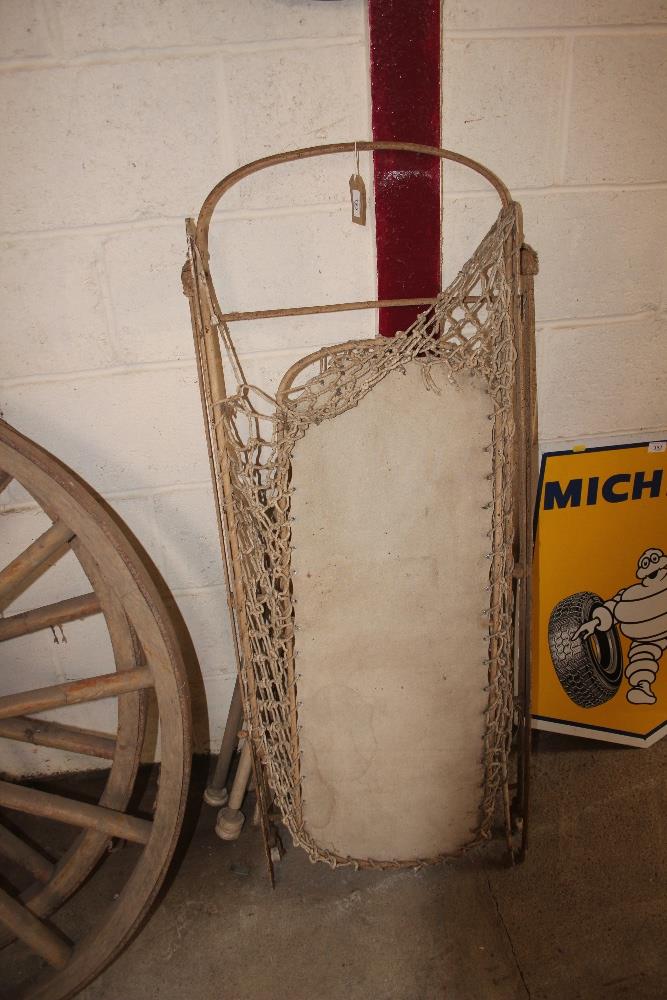 A Victorian folding iron cot