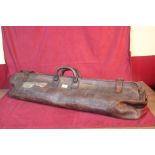 A vintage leather cricket bag