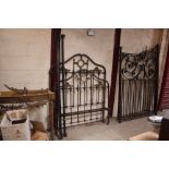 A Victorian ornate brass single bedstead