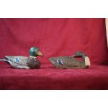 Two wooden decoy ducks