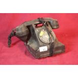 A vintage black telephone