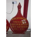 A chemists hardwood advertising sign, bottle shaped 123cm high