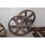 A pair of vintage cast iron wheels 61cm diameter