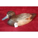 A wooden decoy duck impressed J.W. weighted, 38cm