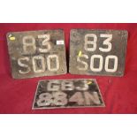 A pair of vintage number plates and one other