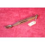 An antique carved oak love spoon, decorated with p