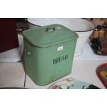 A vintage enamel bread bin