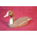 A wooden decoy model of a white front goose, by Gi