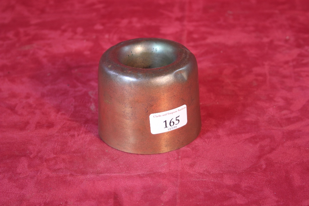 An antique cylindrical copper jelly mould, 8cm hig