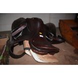 A saddle complete with leather girth