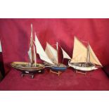 Three various model sailing boats