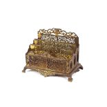 A 19th Century ornate brass letter rack, 20cm high x 26.5cm wide