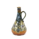 A Doulton stoneware ewer, decorated in the Art Nouveau manner, with raised floral heads, 23cm high