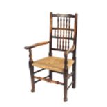 A harlequin set of 8 Yorkshire spindle back dining chairs, having rush seats, raised on turned front
