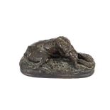 A cast metal anamalier study of a reclining deer hound, signed A. Deva, 16cm long