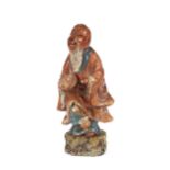 An oriental carved soapstone figure, of an immortal; and another similar 24.5cm high, (2)