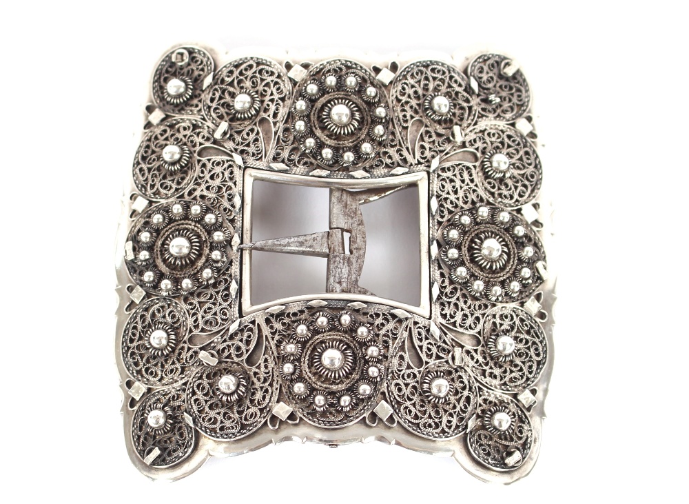 An unusual 19th Century European filigree work white metal belt buckle, dated and signed 1868, 10cm