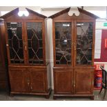 A pair of birdseye maple and cross banded bookcase cabinets, in the 18th Century manner, the