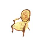 A Victorian carved walnut spoon back armchair, with upholstered seat, back and armrests above