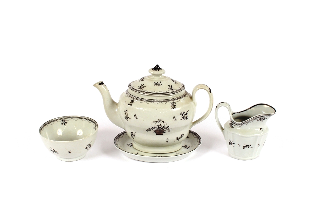 An early 19th Century part tea set, comprising teapot on stand, cream jug, sugar bowl and nine tea