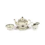 An early 19th Century part tea set, comprising teapot on stand, cream jug, sugar bowl and nine tea