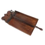 An Antique elm and iron bread cutter, dated 1770