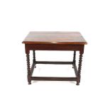 An 18th Century oak plank top side table, raised on barley twist columns, united by chamfered