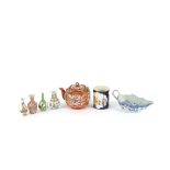 A quantity of various oriental ceramics, to include: a blue and white sauce boat, a famille rose