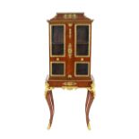 A pair of late 19th Century fine quality French walnut and ormolu mounted vitrines, the upper